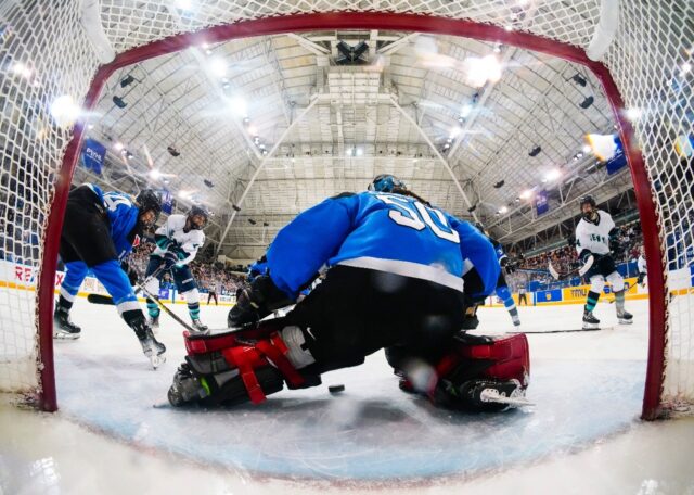 Kayla Vespa #10 of New York scores on Kristen Campbell #50 of Toronto during the third per
