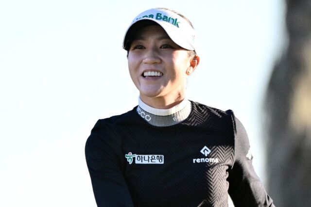 Lydia Ko of New Zealand smiles after firing a four-under par 68 to seize the lead after th