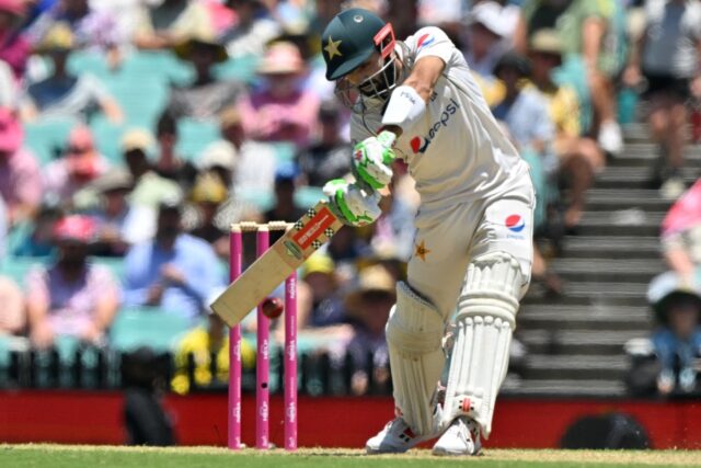 Pakistan's Mohammad Rizwan plays a shot during the first day of the third Test match agai