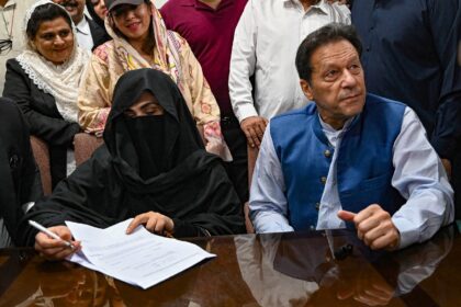 Former Pakistani prime minister Imran Khan (R) and his wife Bushra Bibi (L) have been sent