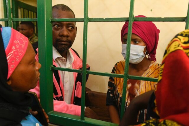 Paul Nthenge Mackenzie (second L) was arrested in April after bodies were discovered in th