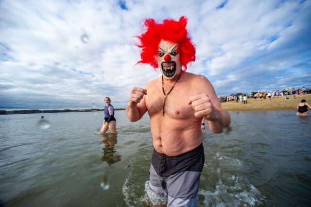 Revelers take part in the annual L Street Brownies’ cold water plunge in Boston on New Y