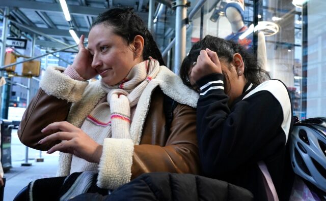 Sally Hernandez, 12, cries after being expelled with her family from a hotel serving as a