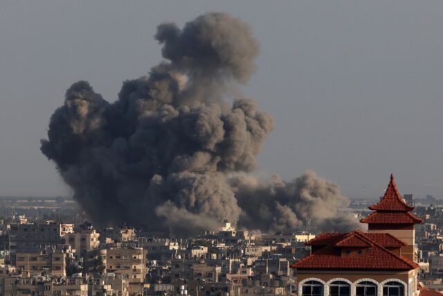 Smoke billows over Khan Yunis in the southern Gaza Strip during Israeli bombardments on Ja