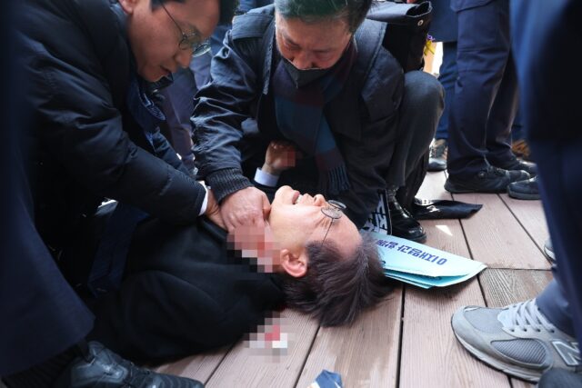 South Korean opposition party leader Lee Jae-myung is attended to after being stabbed in B