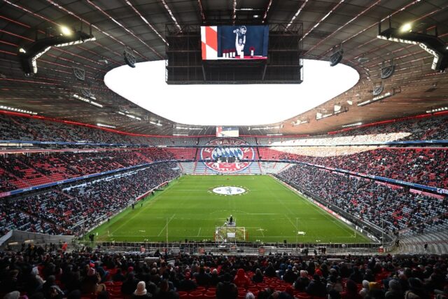 Wreaths of flowers lay next to a picture of late German football legend Franz Beckenbauer