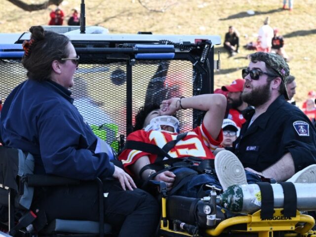 A victim is aided after shots were fired near the Kansas City Chiefs' Super Bowl LVII