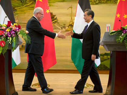 Palestinian Foreign Minister Riyad Al-Maliki, left, and Chinese Foreign Minister Wang Yi r