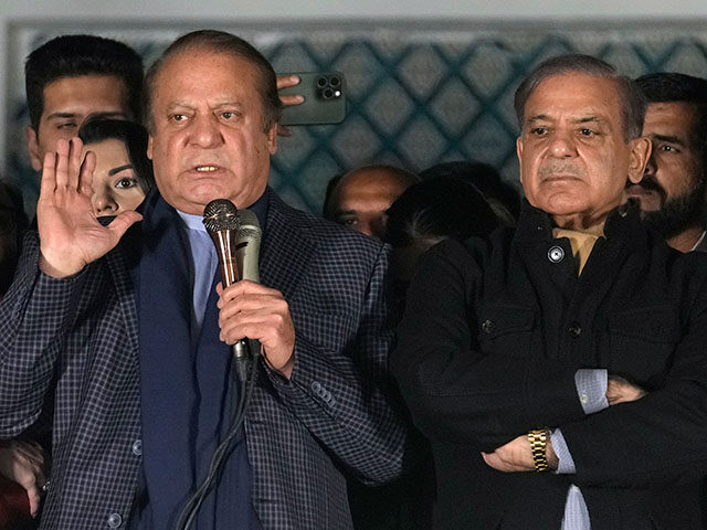 Pakistan's Former Prime Minister Nawaz Sharif, left, addresses supporters next to his