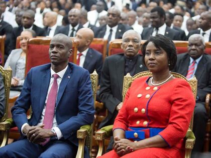 Haiti's President Jovenel Moise sits with his wife Martine during his swearing-in cer