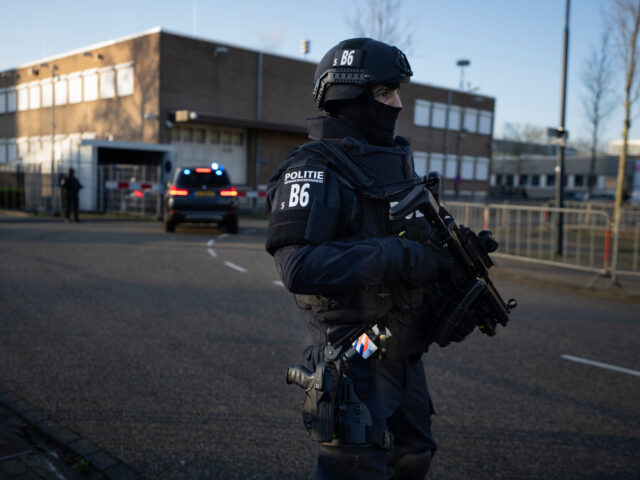 A vehicle carrying suspects arrives at the high security court in Amsterdam, Netherlands,