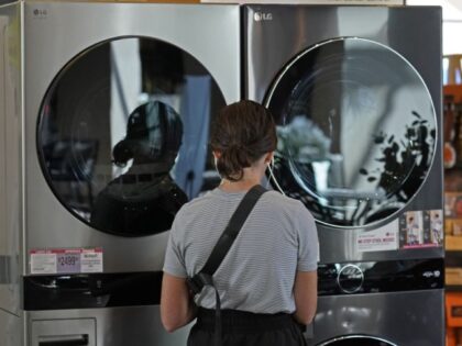A customer looks at LG washing machines and dryers at a RC Willey home furnishings store i