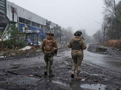 AVDIIVKA, UKRAINE - OCTOBER 26: Two Ukrainian soldiers walk along the destroyed city in th