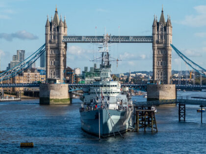LONDON, ENGLAND - OCTOBER 24: The sun shines on HMS Belfast, a historic tourist attraction
