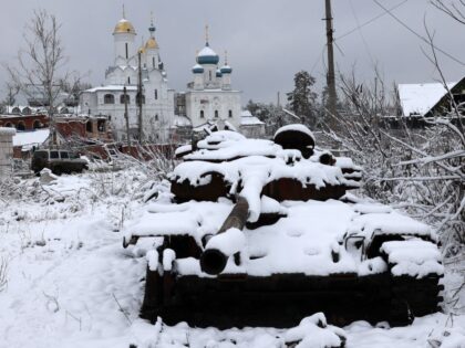 This photograph taken on November 21, 2023 shows a destroyed Russian tank covered by snow