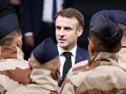 TOPSHOT - France's President Emmanuel Macron meets French soldiers prior to a Christm