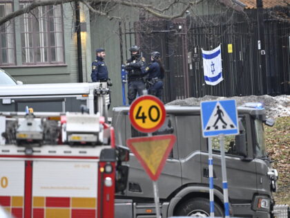 Police officers are seen outside the Israeli embassy in Stockholm, January 31, 2024. A han