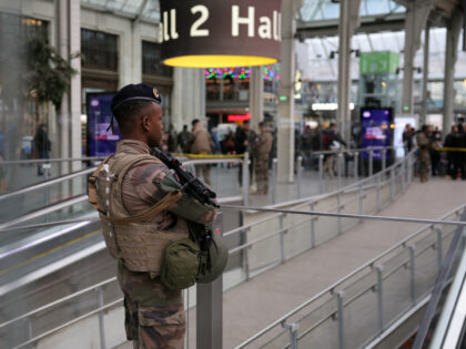 A French soldier of the Sentinelle security operation stands guard in a hall after a knife