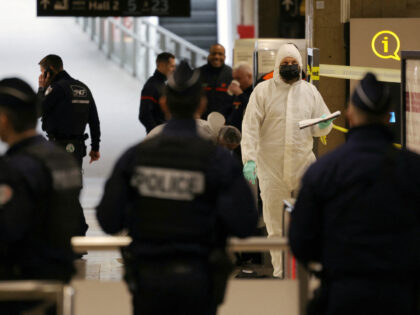 French forensic experts and police work after a knife attack at Paris's Gare de Lyon railw