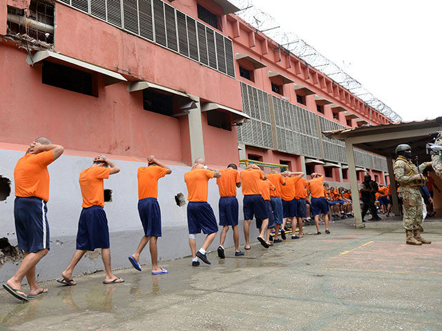 Soldiers guard inmates during an operation at the Guayas 5 prison in Guayaquil, Ecuador, o