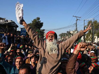 Supporters of the Pakistan Tehreek-e-Insaf (PTI) protest outside a temporary election comm