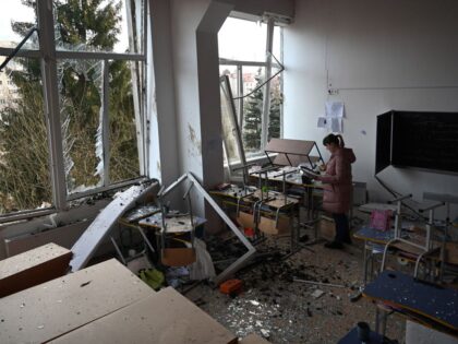 A school director inspects a classroom damaged as a result of a missile attack in Lviv, we