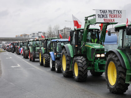 KRAKOW, POLAND - FEBRUARY 20: Farm tractors drive slowly to block the street in Krakow, Po