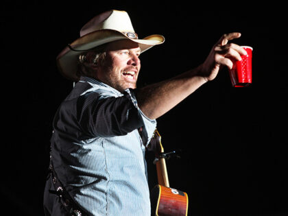 Toby Keith toasts his fans with a red solo cup, the name of one of his hit songs on the Ma