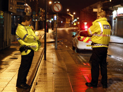 Greater Manchester Police on Bridge Street, after disturbances broke out in the Heywood ar