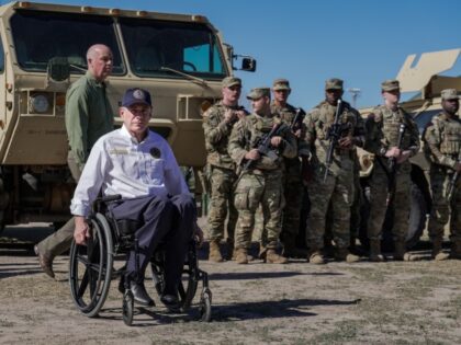 National Guard stands behind Texas Gov. Greg Abbott and fellow Governors as they hold a pr