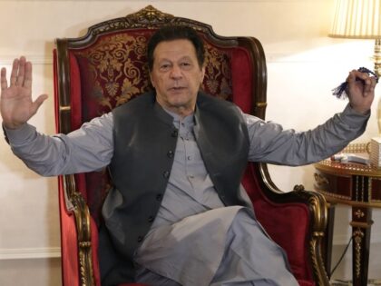 Pakistan's former prime minister Imran Khan talks with reporters regarding the curren