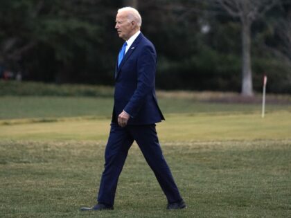 President Joe Biden walks to board Marine One at the White House in Washington, Friday, Fe