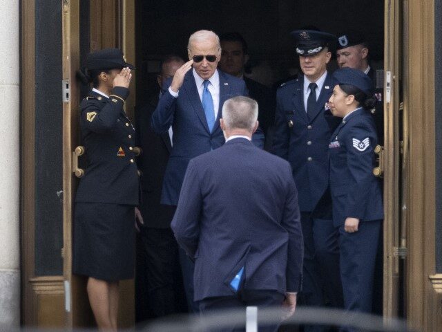 US President Joe Biden, center, departs from Walter Reed National Military Medical Center