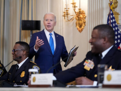 President Joe Biden speaks as he meets with law enforcement officials in the State Dining