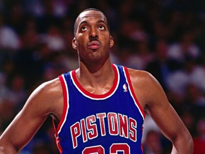 SACRAMENTO, CA - 1992: John Salley #22 of the Detroit Pistons looks up to the scoreboard d
