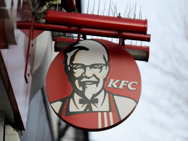 FILE - A logo on a sign is displayed above a branch of KFC in the Surbiton suburb of south