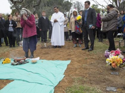 Los Angeles County holds a burial service at a mass grave for the 1,457 unclaimed remains