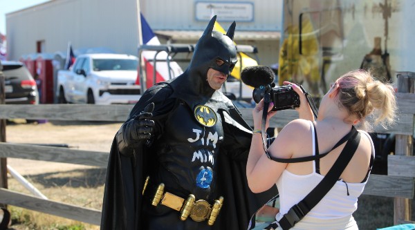 Man in Batman Costume markets a product outside rally. (Randy Clark/Breitbart Texas)