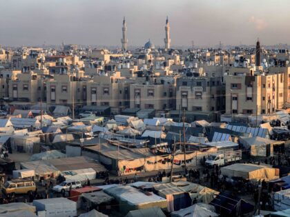 The Taiba mosque is pictured in the background near the tent camps of displaced Palestinia