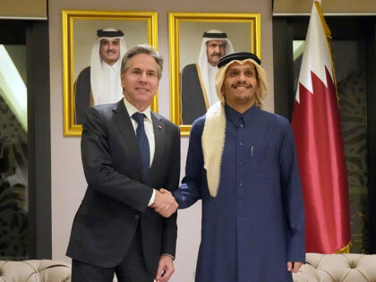 US Secretary of State Antony Blinken, left, shakes hands with Qatar's Prime Minister and F