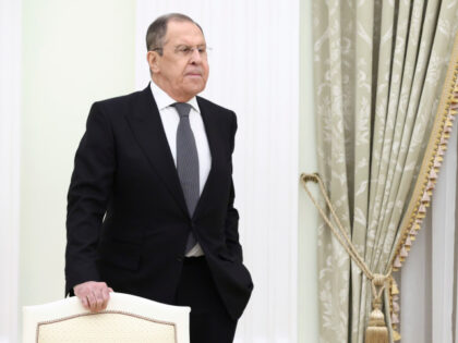 Russian Foreign Minister Sergey Lavrov stands waiting for the talks between Russian Presid