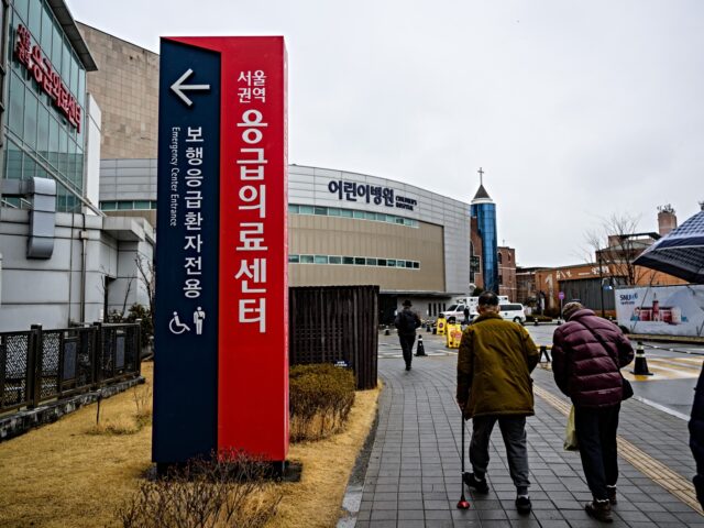 People walk on the grounds of the Seoul National University Hospital in Seoul on February