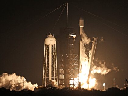 A SpaceX Falcon 9 rocket lifts off from launch pad LC-39A at the Kennedy Space Center with
