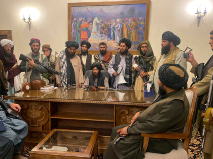 FILE - Taliban fighters take control of the Afghan presidential palace after Afghan Presid
