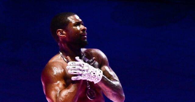 NextImg:Usher at Half-Time Show: 'Only God Answers Prayers'