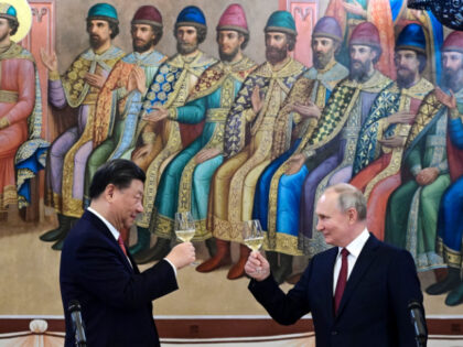 FILE - Russian President Vladimir Putin, right, and Chinese President Xi Jinping toast dur