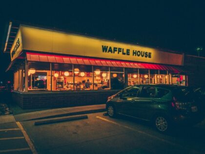 An outside view of Waffle House at night (Unsplash/Simon Daoudi)