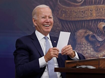 WASHINGTON, DC - JULY 28: U.S. President Joe Biden reads a note from an aide saying that t
