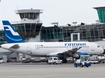 Aircraft operated by Finnair Oyj are prepared for flight by ground staff at Helsink-Vantaa