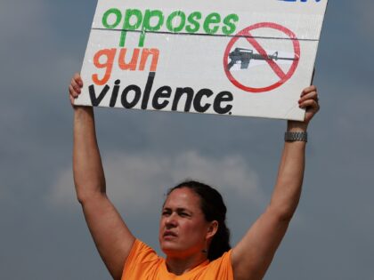 LLEN, TEXAS - MAY 07: People protest against gun violence outside of the Cotton wood Creek